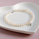 Girl's Seed Pearl Bracelet with Tiny Heart Charm